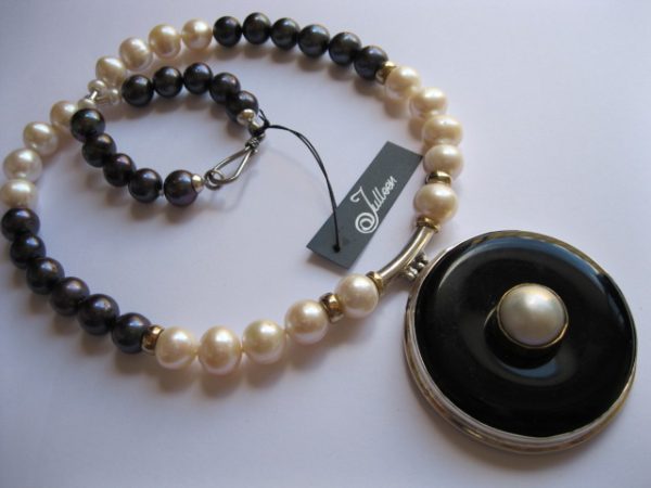 Boogie White Mabe Onyx Donut Pendant on Black and White Pearls.